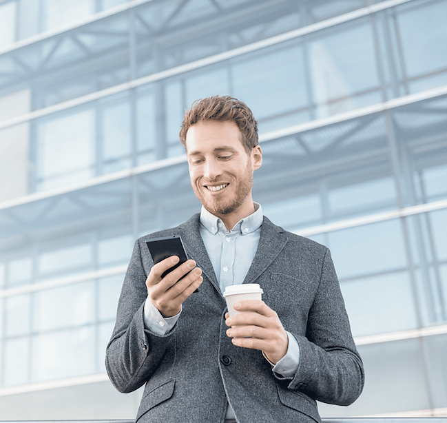 Professional businessman with phone and coffee