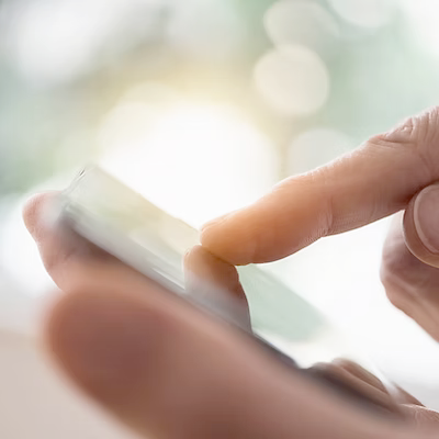 Hands holding smartphone with notifications